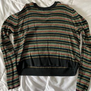 A colorful sweater, sort of cropped.